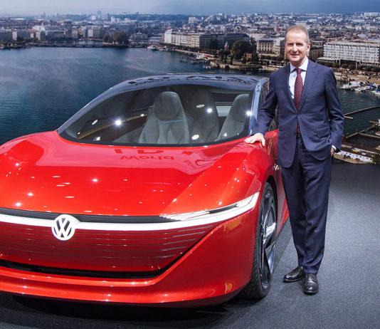 Herbert Diessa in front of a VW concept electric car